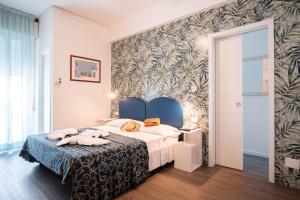 Postel nebo postele na pokoji v ubytování Blu Star Hotel