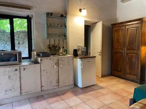 a kitchen with a refrigerator and a microwave at Gentilini Retreat in Argostoli +18 photos