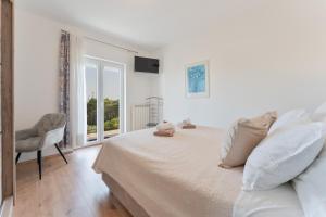 En eller flere senge i et værelse på Apartman Nino + 49 billeder