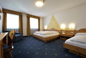 Postel nebo postele na pokoji v ubytování Hotel Urthaler