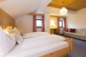 Postel nebo postele na pokoji v ubytování Hotel Urthaler