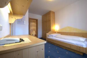 Postel nebo postele na pokoji v ubytování Hotel Urthaler