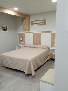 Ένα ή περισσότερα κρεβάτια σε δωμάτιο στο Hostal La Morenica