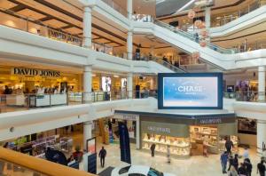 a shopping mall with a large screen in the middle at SPR House Chatswood 3 bedrooms - 1 in Sydney