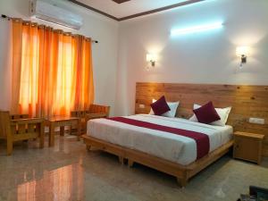 Ένα ή περισσότερα κρεβάτια σε δωμάτιο στο Panchakarma Retreat - Earth Roots Ayurveda