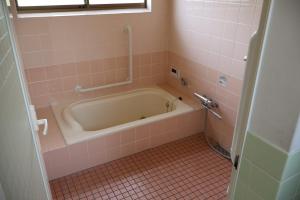 Baðherbergi á Guest House Kurukuru ゲストハウスくるくる