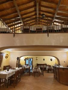 a restaurant with tables and chairs in a room at Agriturismo Tenute Spartà in Randazzo +29 photos