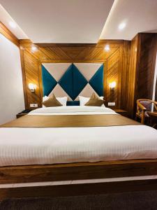Postel nebo postele na pokoji v ubytování Hotel Vishranti