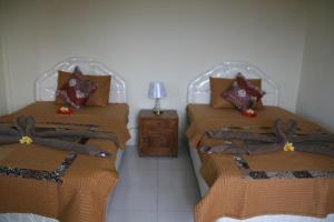 Postel nebo postele na pokoji v ubytování Santun Homestay