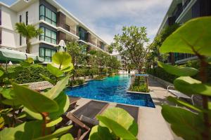 a swimming pool in the middle of a building at Title III and II by Villacarte in Rawai Beach