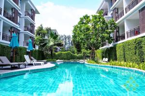 a swimming pool in the middle of a building at Title III and II by Villacarte in Rawai Beach