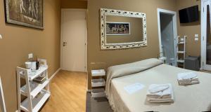 A bed or beds in a room at Villa Castello only room