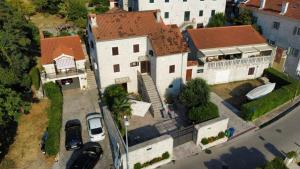 an overhead view of a house with a large yard at Lazovic- Apartment by the Sea with Amazing View in Dobrota