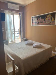 A bed or beds in a room at Villa Castello only room