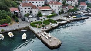 an aerial view of a marina with boats in the water at Lazovic- Apartment by the Sea with Amazing View in Dobrota