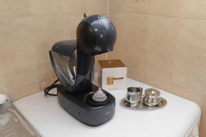 a black mixer sitting on top of a counter at Lazovic- Apartment by the Sea with Amazing View in Dobrota