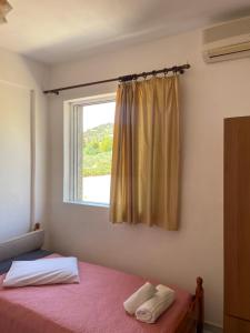 Postel nebo postele na pokoji v ubytování Tasos Manaritsas Rooms
