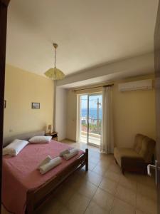 Postel nebo postele na pokoji v ubytování Tasos Manaritsas Rooms