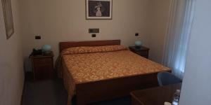 Postel nebo postele na pokoji v ubytování Hotel Il Timone