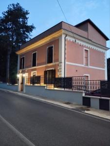 a building on the side of a street at VILLINO CHELIDONIA SUBIACO in Subiaco