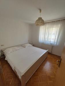 Katil atau katil-katil dalam bilik di Apartments and Rooms Mamić