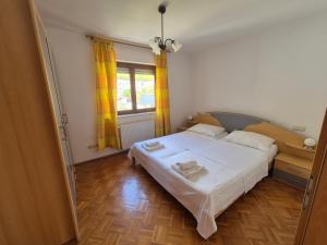Katil atau katil-katil dalam bilik di Apartments and Rooms Mamić