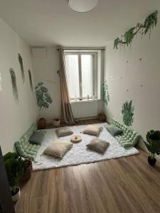 a living room with a large bed in the middle of a room at A&M Games and spa in Charleville-Mézières