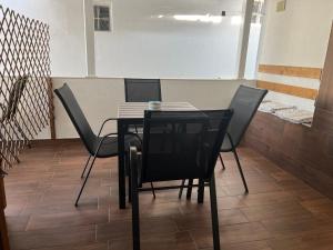 a black table and chairs in a room at Guest House Kalina,Studio 3 in Ammouliani +12 photos