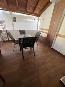 a dining room with a table and chairs at Guest House Kalina,Studio 3 in Ammouliani
