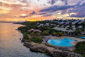 an aerial view of a resort with a pool at LA VIDA LOCA - Anse des Rochers in Saint-François