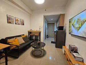 a living room with a couch and a table at Q Workcation WFH Staycation in Manila