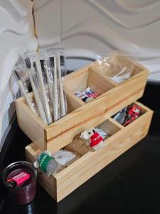 a wooden box filled with plastic utensils on a table at Q Workcation WFH Staycation in Manila