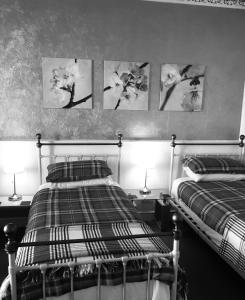 Postel nebo postele na pokoji v ubytování Cameron Guest House