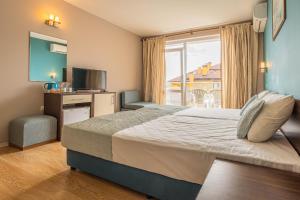 Postel nebo postele na pokoji v ubytování Valeo Hotel