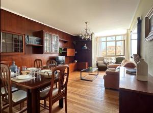 a kitchen and living room with a table and chairs at Miramar - 5710 in Quejo