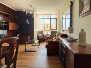 a living room with a couch and a table at Miramar - 5710 in Quejo