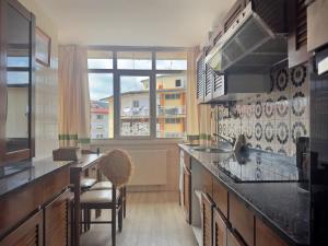 a kitchen with a large window and a counter top at Miramar - 5710 in Quejo +11 photos
