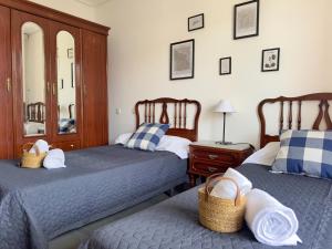 a bedroom with two beds and a mirror at Miramar - 5710 in Quejo