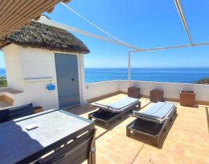 a balcony with a view of the ocean at Mandala Bungalows - Adults Only in Los Caños de Meca