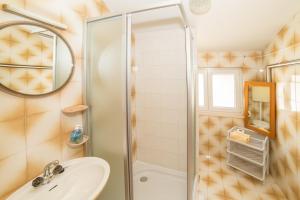 a bathroom with a shower and a sink at Villa Nada in Duće +8 photos