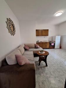 a living room with a couch and a table at Dobrota Comfort in Kotor +7 photos