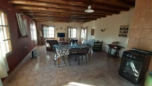 a large living room with a table and chairs at Chez-Jelú in Rodeo