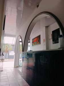Una televisión o centro de entretenimiento en Hotel Unión