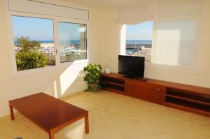Телевизор и/или развлекательный центр в Residencial Marina de Port