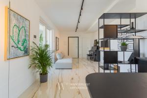 a living room with a couch and a table at Wanderlust Experience Zenith Rooftop in Bitonto