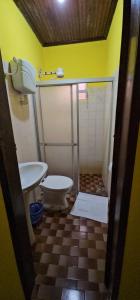 a bathroom with a toilet and a sink at Hostel Beach in Porto Seguro +23 photos