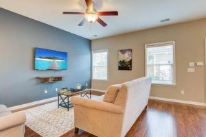 a living room with a ceiling fan and a couch at Home Sweet Home in Charleston! 3BR full amenities in Charleston