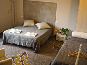 Postel nebo postele na pokoji v ubytování B&B Cernaia 42