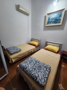 Postel nebo postele na pokoji v ubytování Bozovic Apartments I