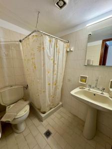 a bathroom with a toilet and a sink at Onar Seaview Apartment in Pythagorio in Pythagoreio